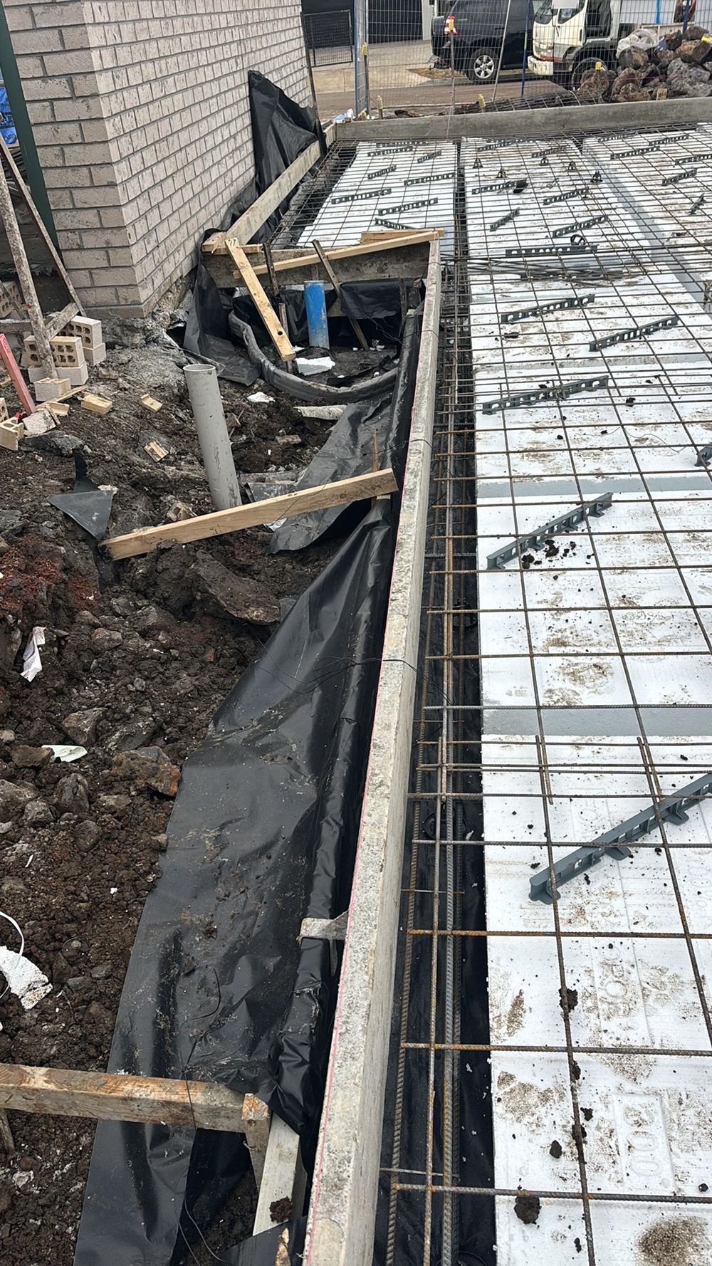 Slab formwork needs more bracing so it holds its shape during the pour, found during a bored pier inspection in Wollert