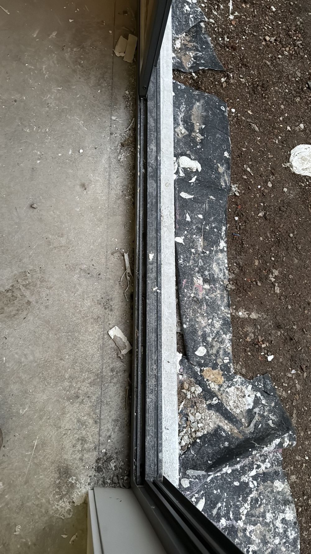 Sliding door tracks needing a clean to stop the rollers being damaged, found during a fixing inspection in Wollert