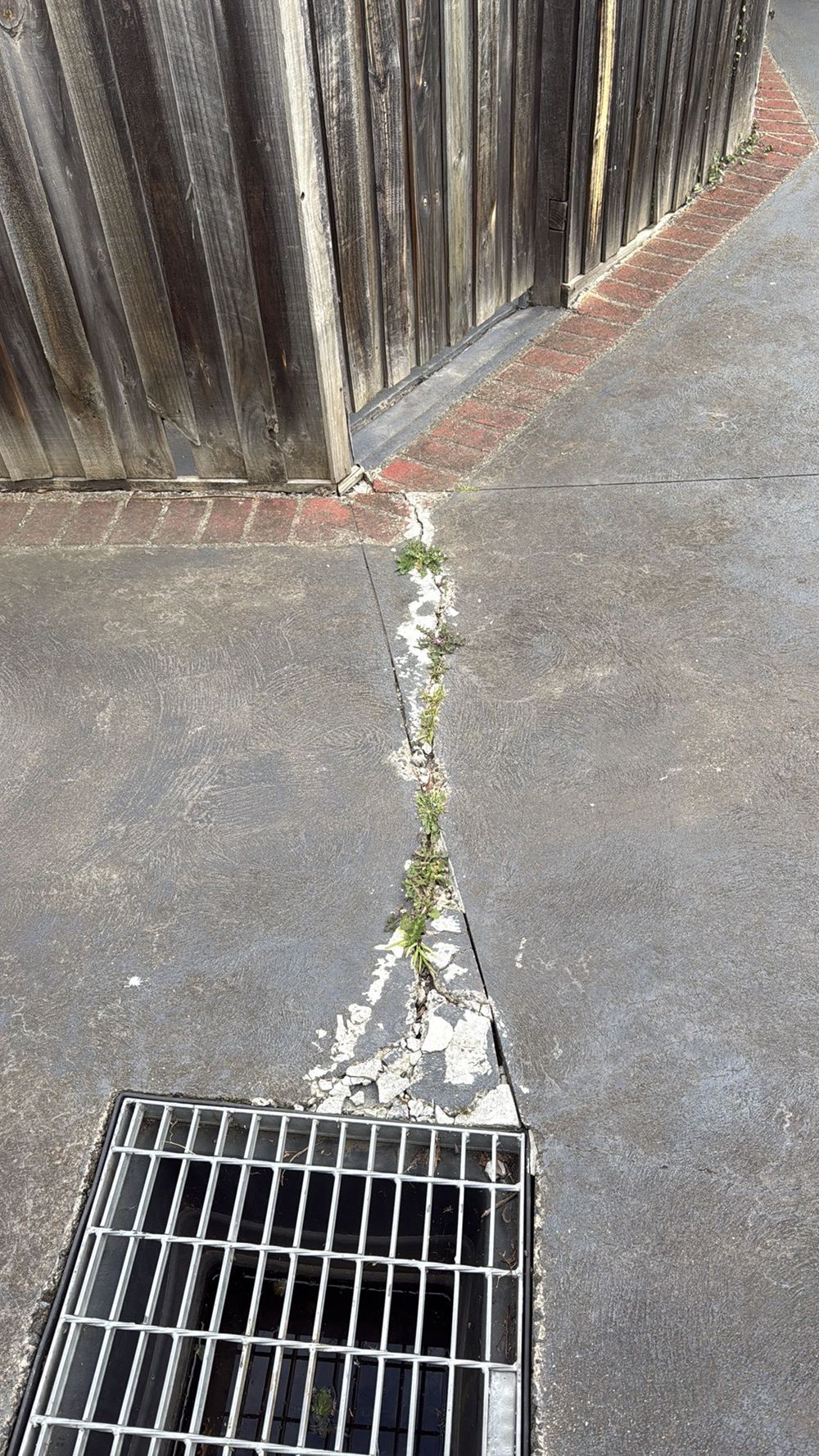 Major cracking in the concrete, likely from too little reinforcement or a thin slab, found during a pre-purchase inspection in Preston
