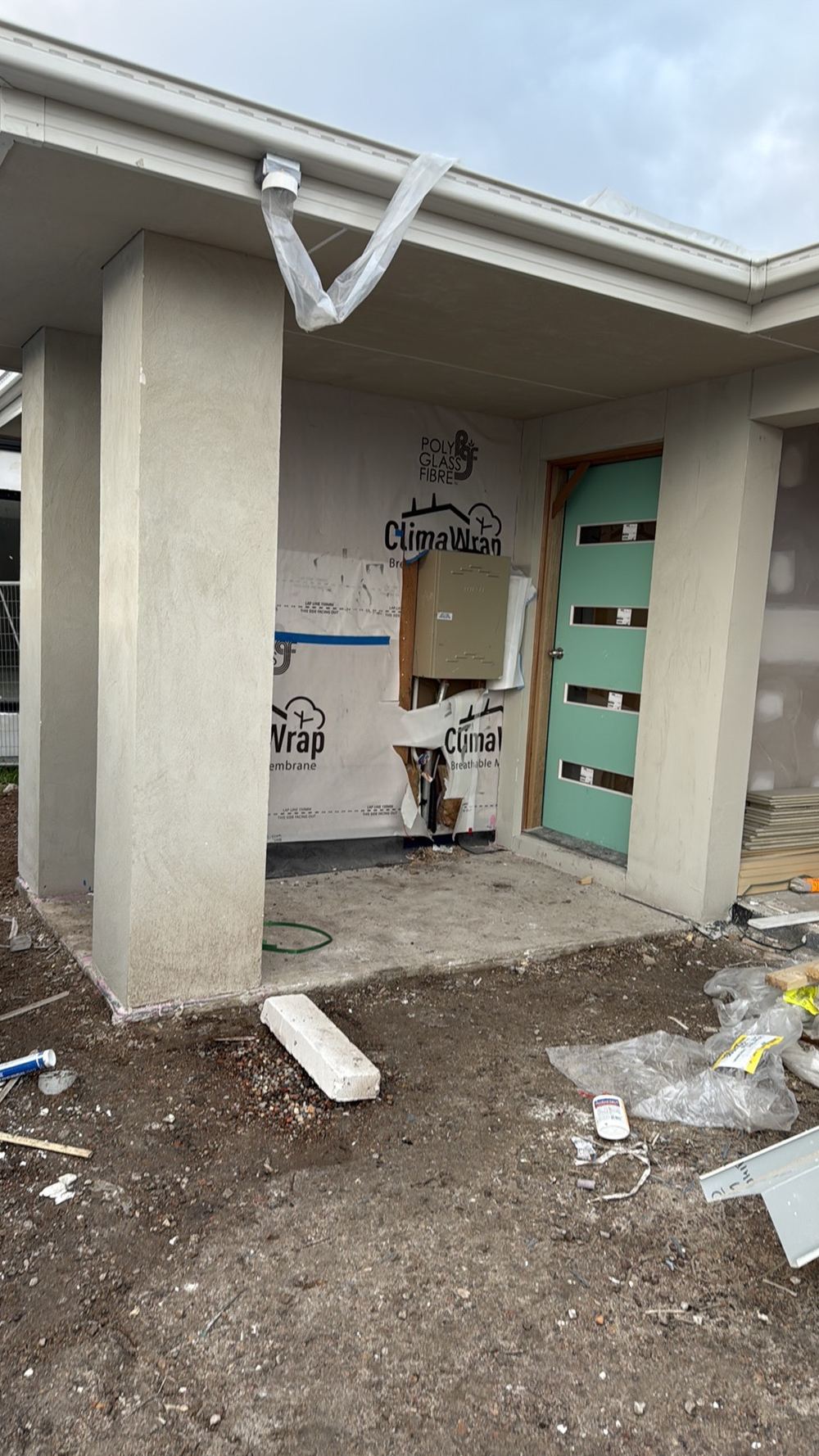 Temporary downpipes not discharging to stormwater, so water ponds around the slab, Wollert